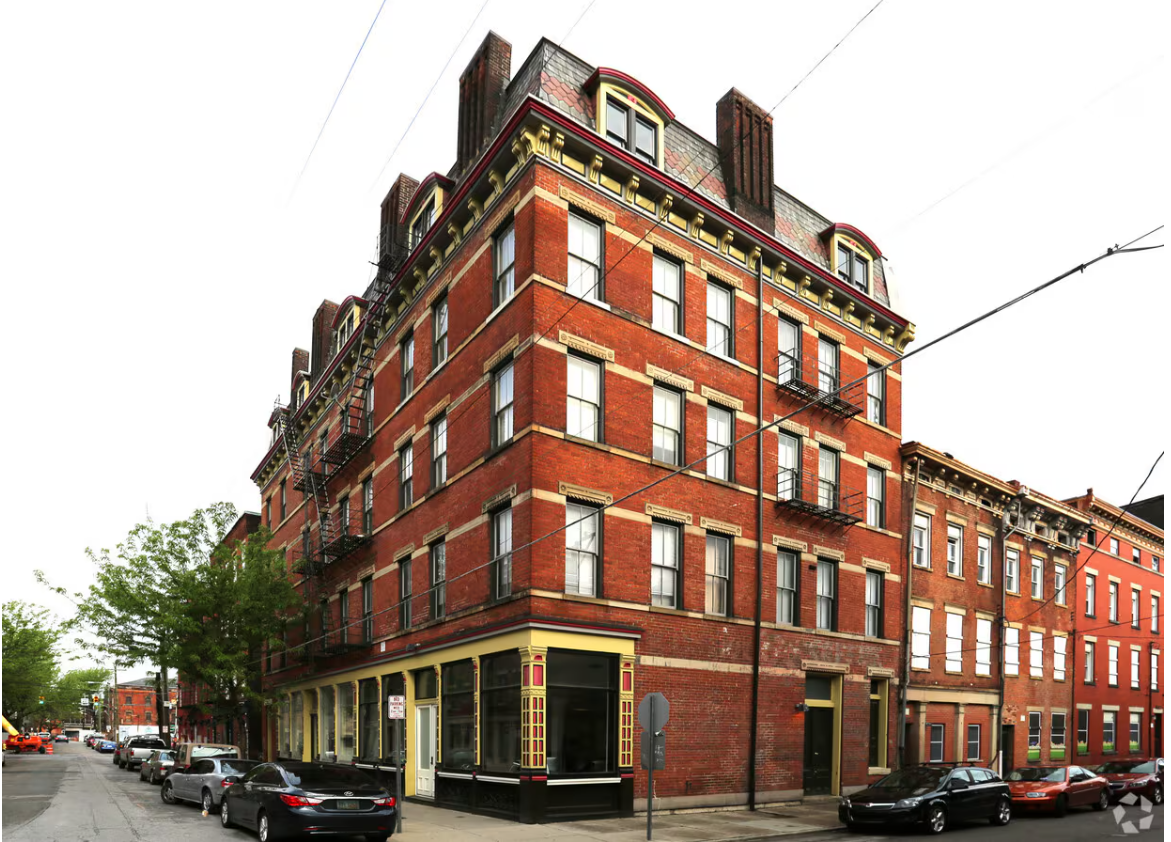 OTR building used in the electrification study: double-wythe red brick on stacked-stone foundation.
