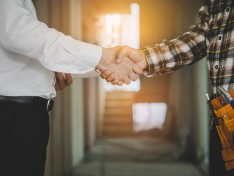 Building professionals shaking hands