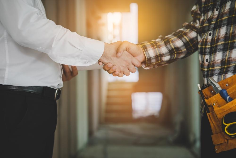 Building professionals shaking hands