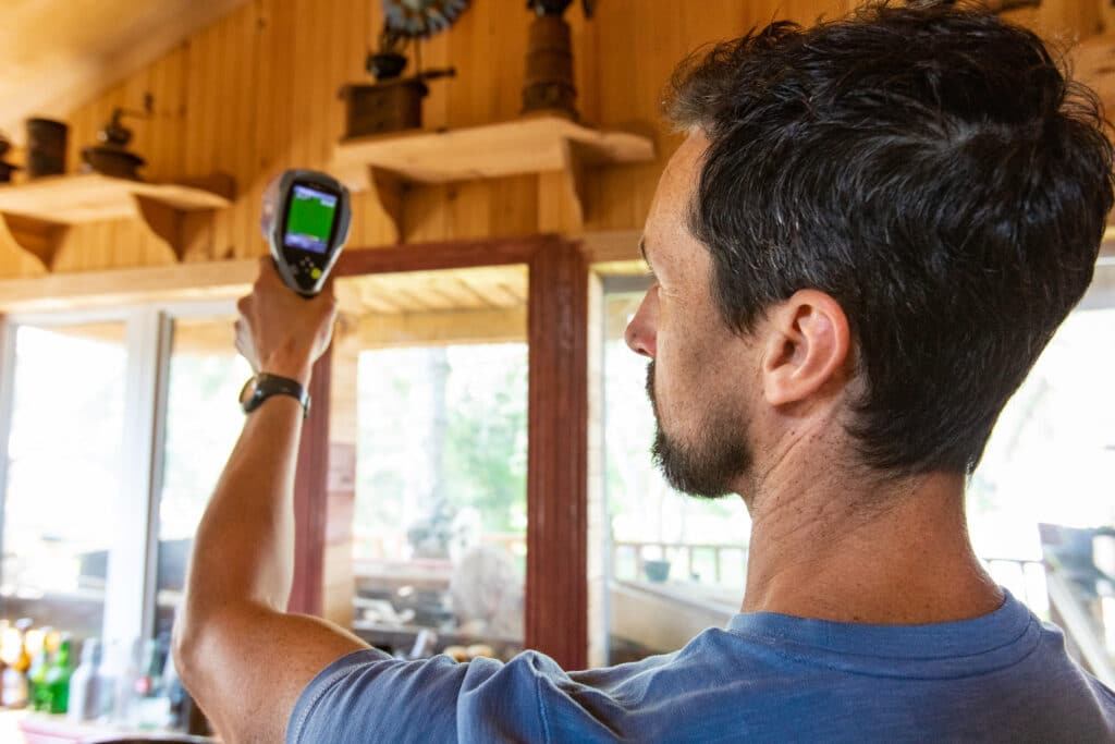 HVAC professional conducting energy audit