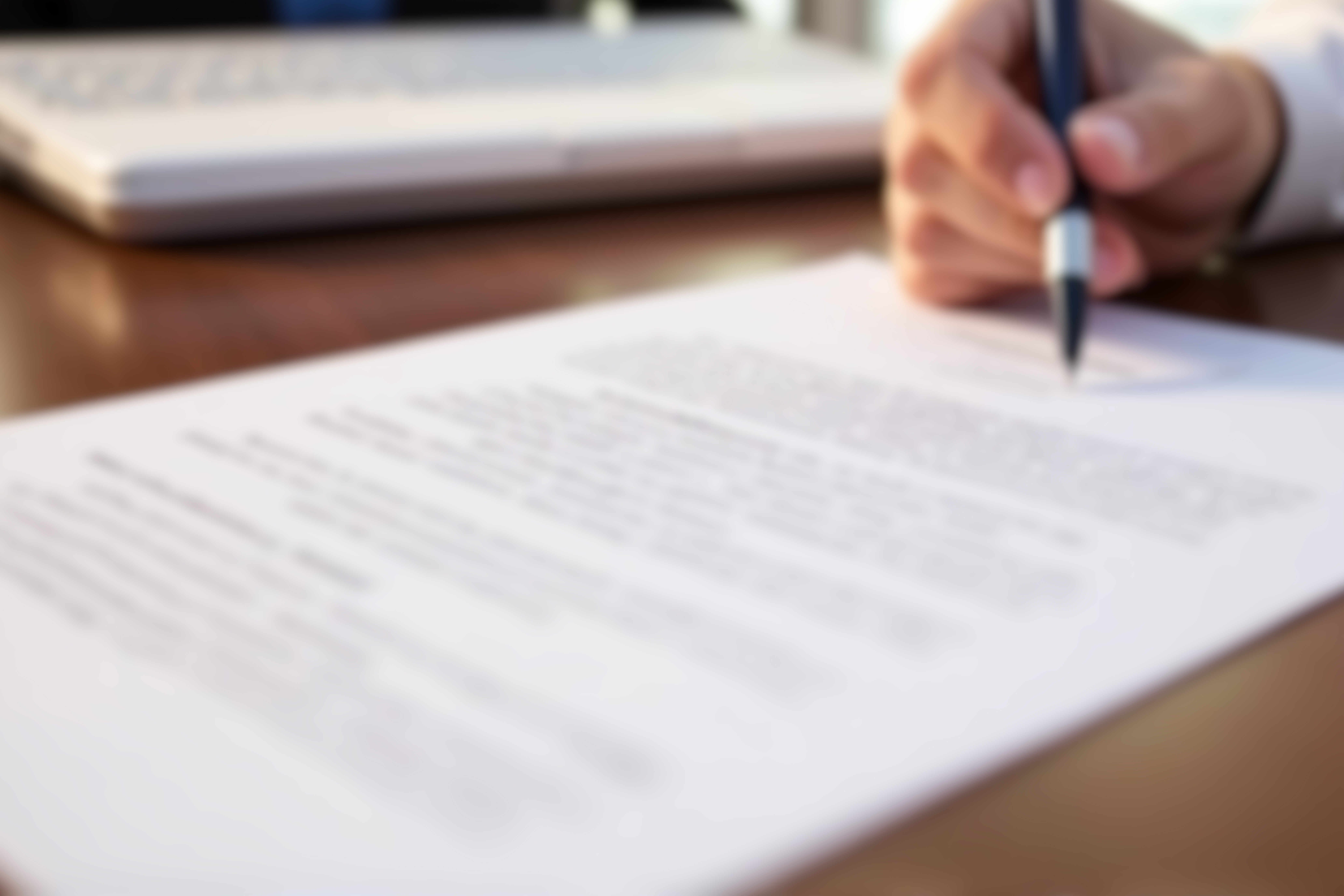 person signing a document